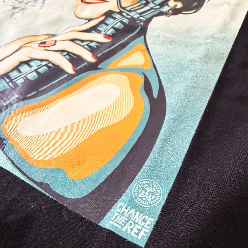 Close-up of the My Favorite Son T-shirt print showing detailed Shepard Fairey artwork and Change the Ref logo